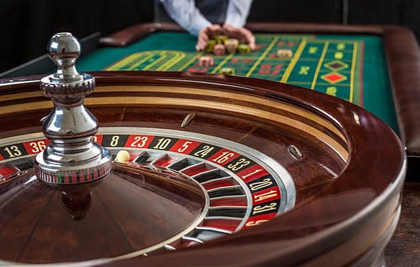 Live roulette table with wheel and betting layout display